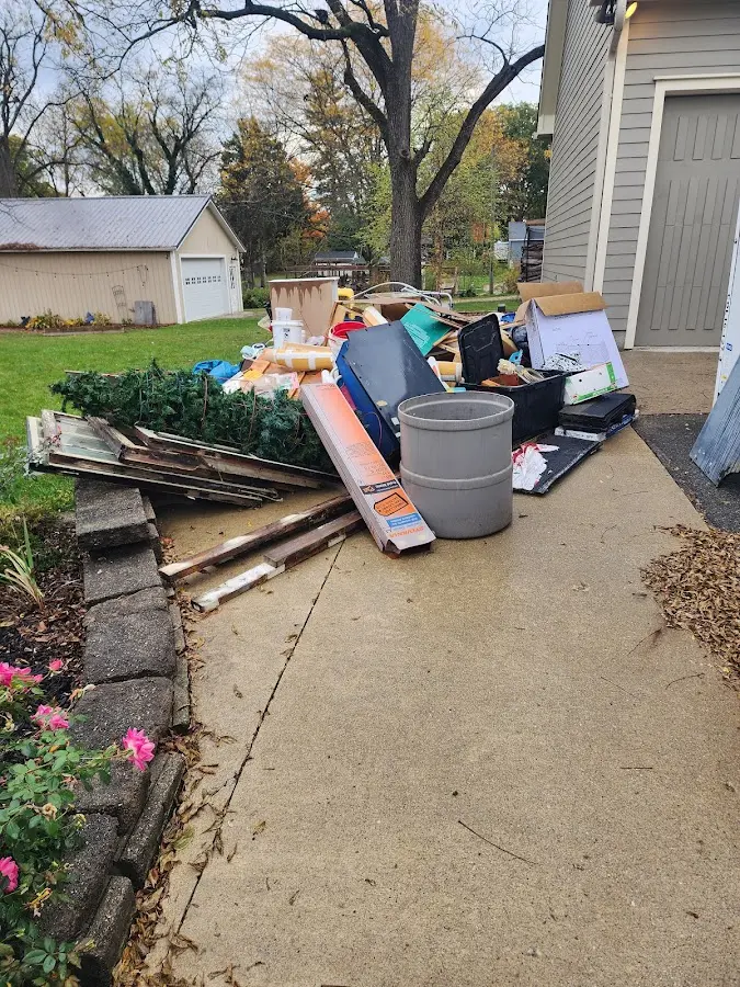 Dumpster being loaded with debris for 3 Yard Dumpster Rental in Eureka